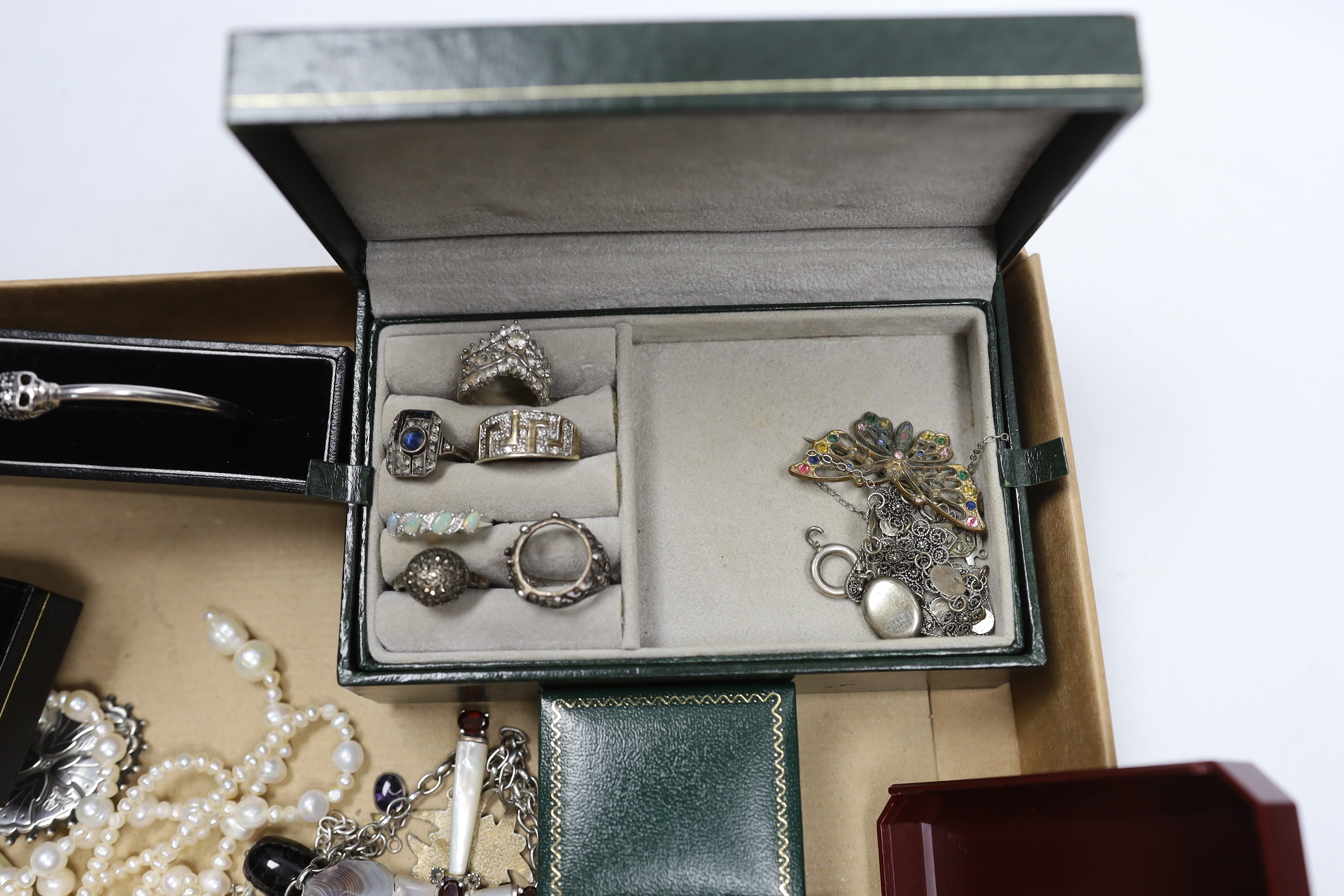 A quantity of assorted silver, 925, white metal and other jewellery including torque necklace, cross pendant necklace, marcasite and onyx set drop earrings, enamelled cross brooch, bangle, medals, dress rings, freshwater